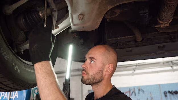 car-diagnostics-auto-mechanic-inspects-car-auto-repair-shop-breaking-transmission